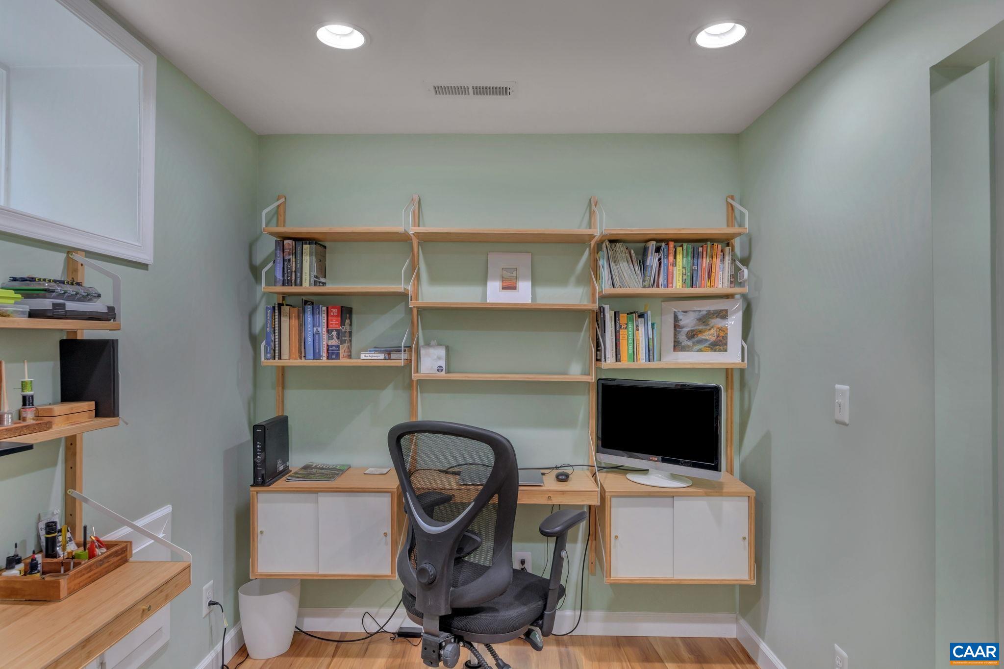 5543 Summerdean Road Crozet, VA 22932 - Photo 30 of 59 a workspace with furniture and a book shelf
