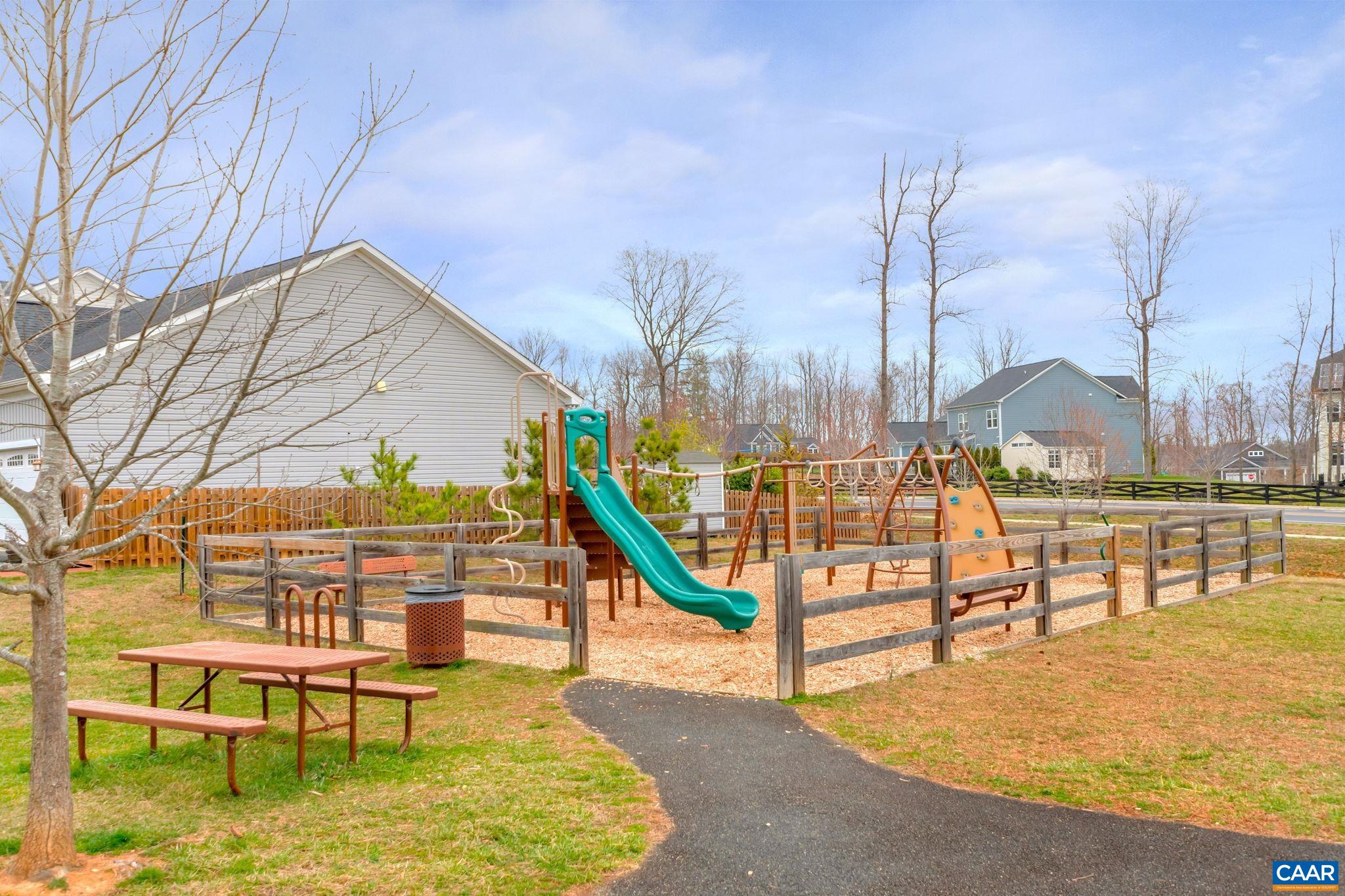 5543 Summerdean Road Crozet, VA 22932 - Photo 41 of 59 a view of a swimming pool with a bench and chair