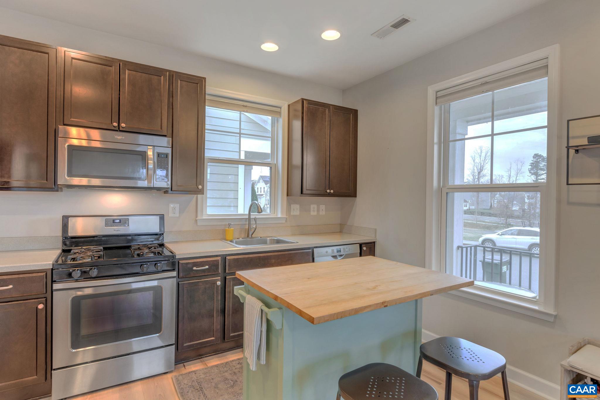 5543 Summerdean Road Crozet, VA 22932 - Photo 9 of 59 a kitchen with a stove a sink and a microwave