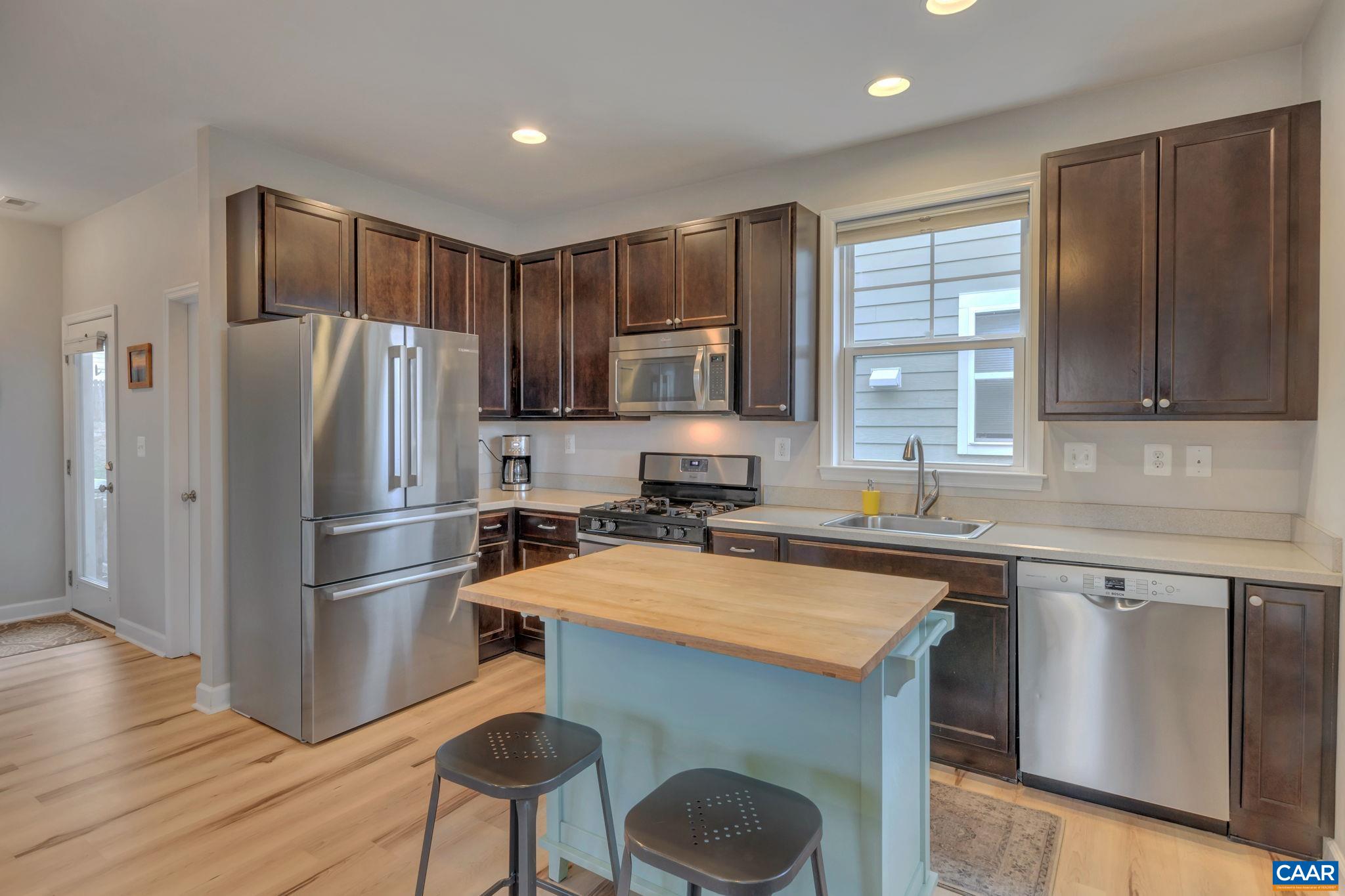 5543 Summerdean Road Crozet, VA 22932 - Photo 10 of 59 a kitchen with stainless steel appliances a refrigerator stove and sink