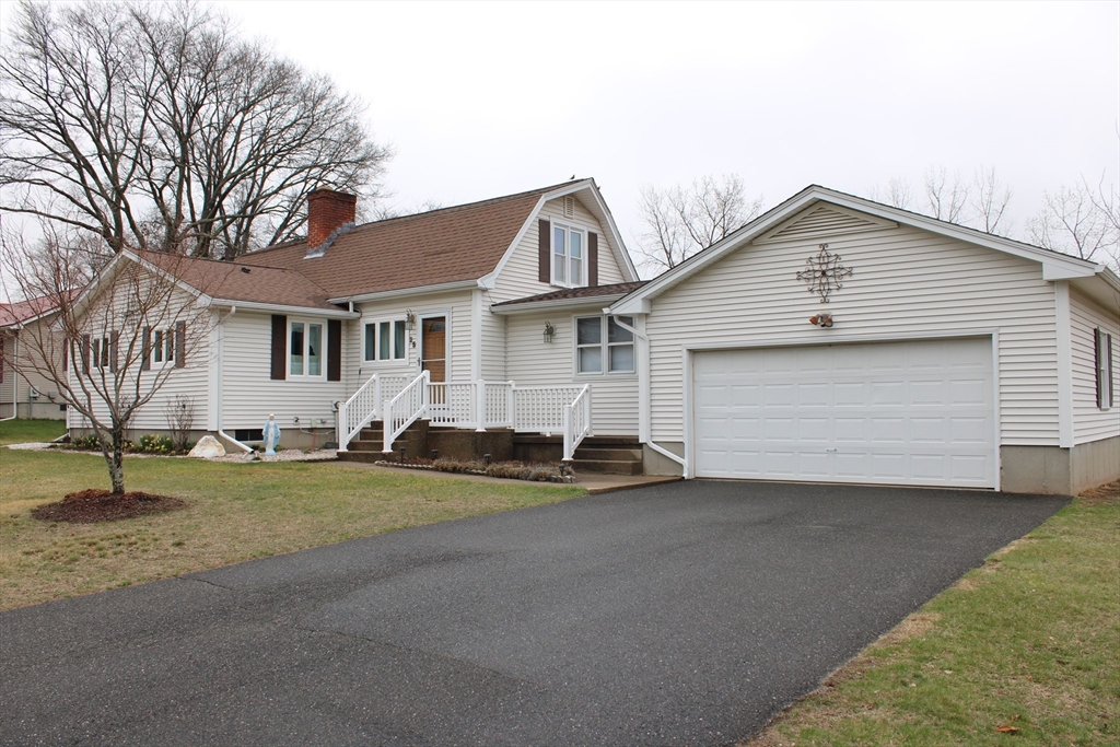 25 Lafond Drive Chicopee, MA 01020 - Photo 1 of 24 a front view of a house with a yard and garage