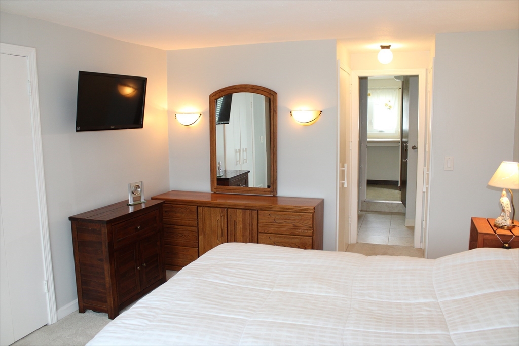 25 Lafond Drive Chicopee, MA 01020 - Photo 11 of 24 a bedroom with a bed and a flat screen tv