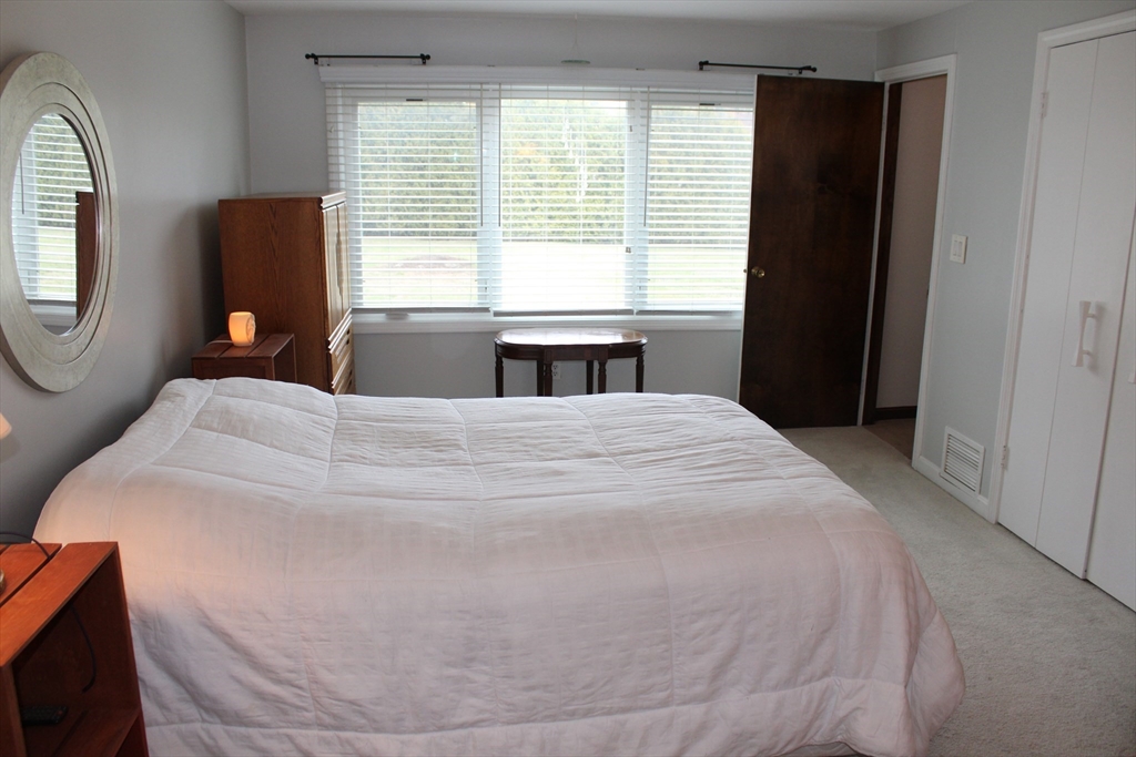 25 Lafond Drive Chicopee, MA 01020 - Photo 12 of 24 a large bed sitting in a bedroom next to a window