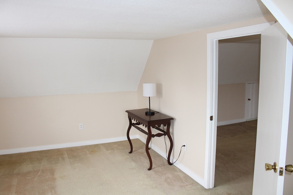 25 Lafond Drive Chicopee, MA 01020 - Photo 17 of 24 a bench sitting in a room