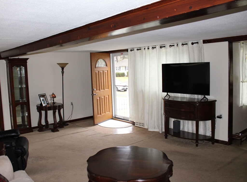 25 Lafond Drive Chicopee, MA 01020 - Photo 4 of 24 a living room with furniture and a flat screen tv