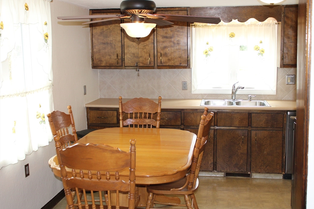25 Lafond Drive Chicopee, MA 01020 - Photo 7 of 24 a kitchen with a table and chairs in it