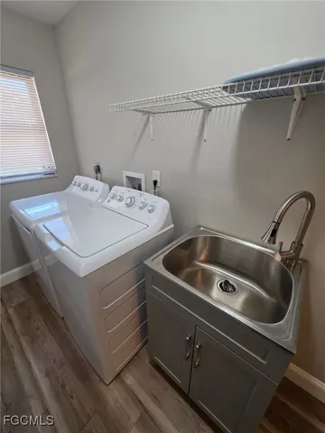 a view of a livingroom with a ceiling fan and window