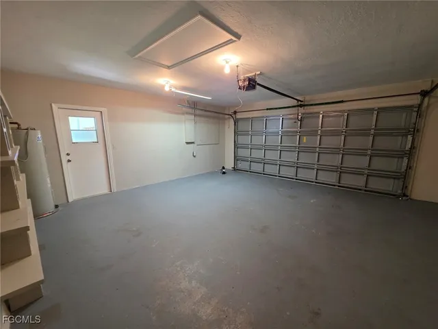 a view of a house with a yard and a garden