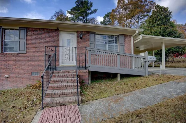 a view of a wooden house with a yard