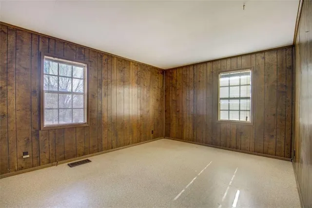 an empty room with windows