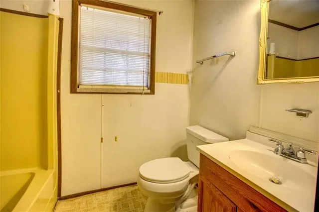 a bathroom with a sink and a toilet