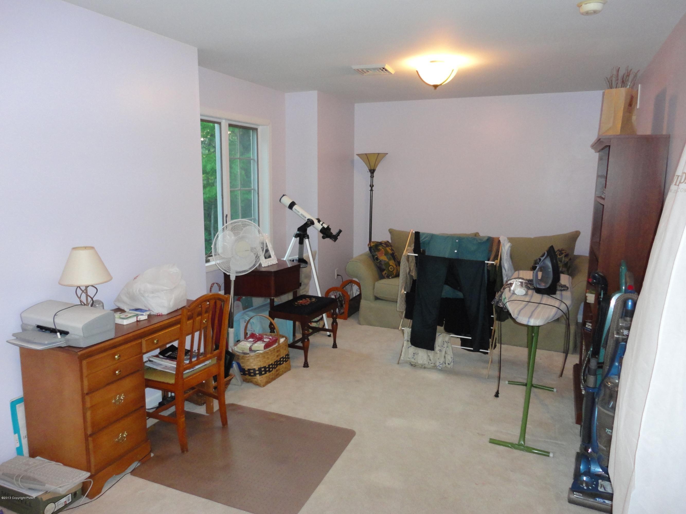 391 Turkey Ridge Road Mount Bethel, PA 18343 - Photo 11 of 19 a living room with furniture and a fireplace
