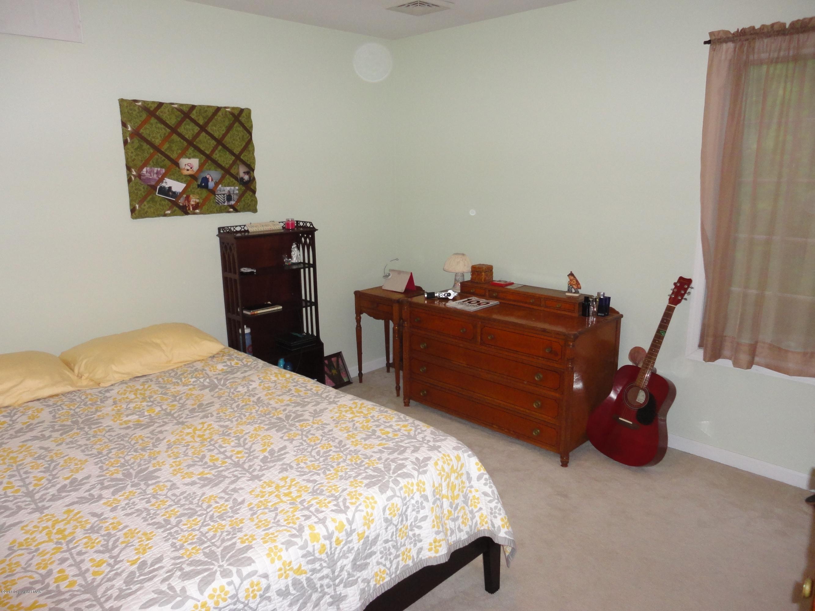 391 Turkey Ridge Road Mount Bethel, PA 18343 - Photo 12 of 19 a bed sitting in a bedroom and dresser