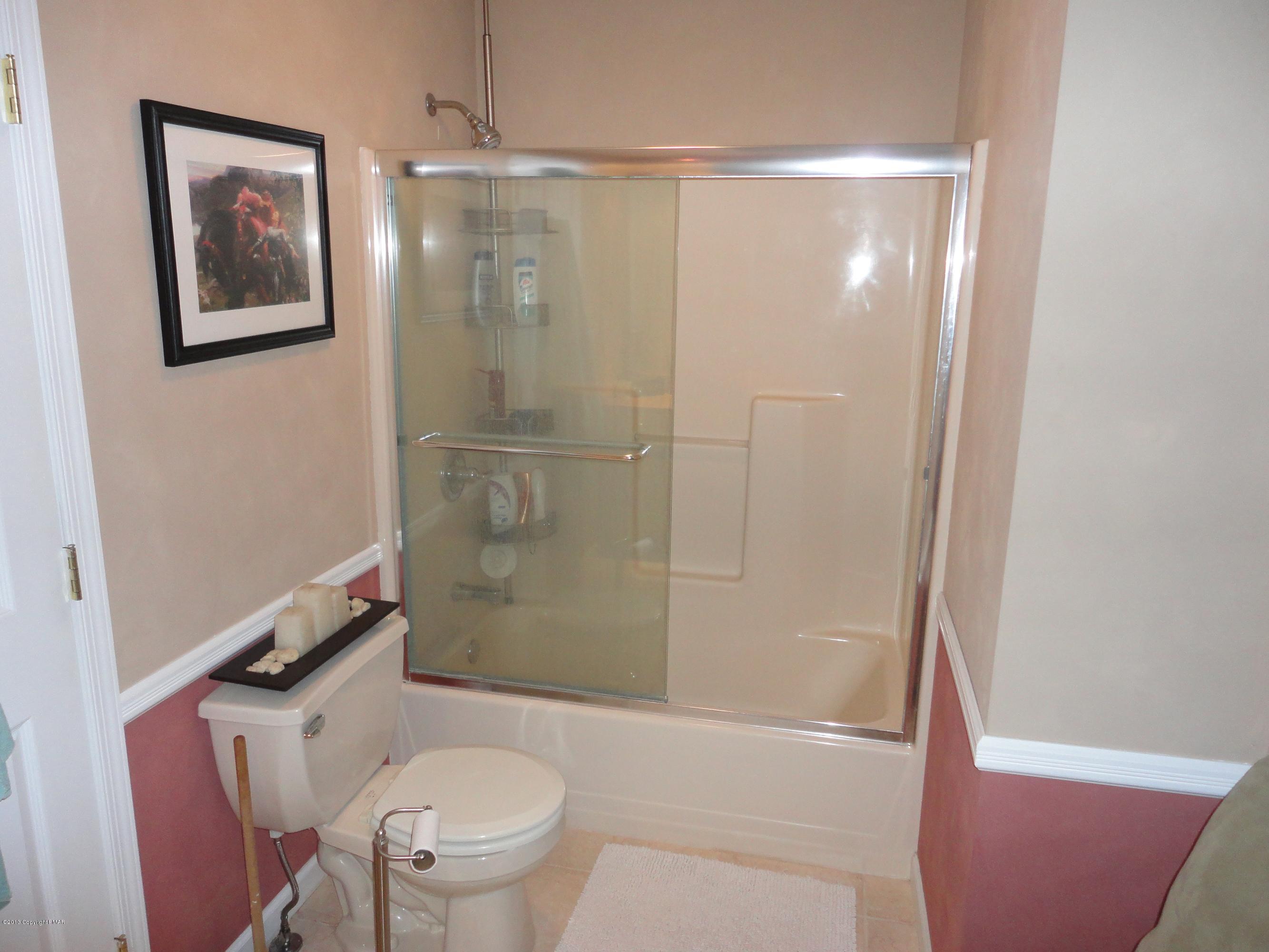 391 Turkey Ridge Road Mount Bethel, PA 18343 - Photo 15 of 19 a bathroom with a shower a toilet and a sink