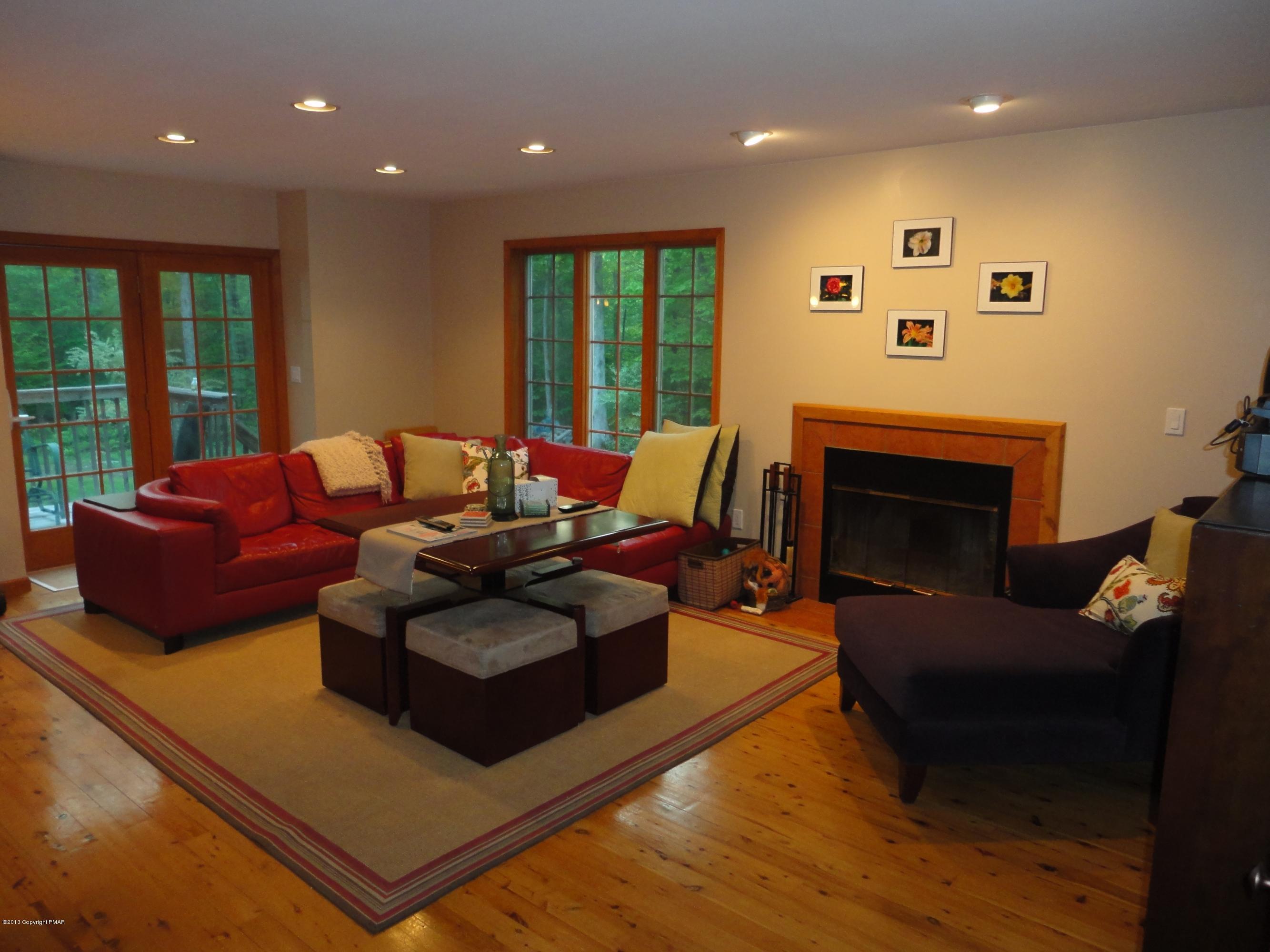 391 Turkey Ridge Road Mount Bethel, PA 18343 - Photo 3 of 19 a living room with furniture and a fireplace