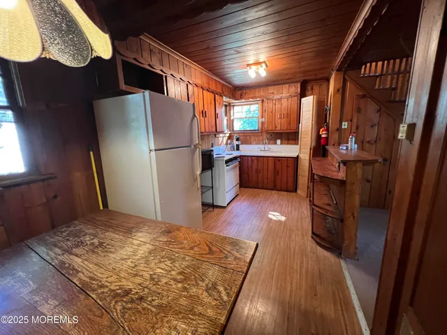 a kitchen with refrigerator and window