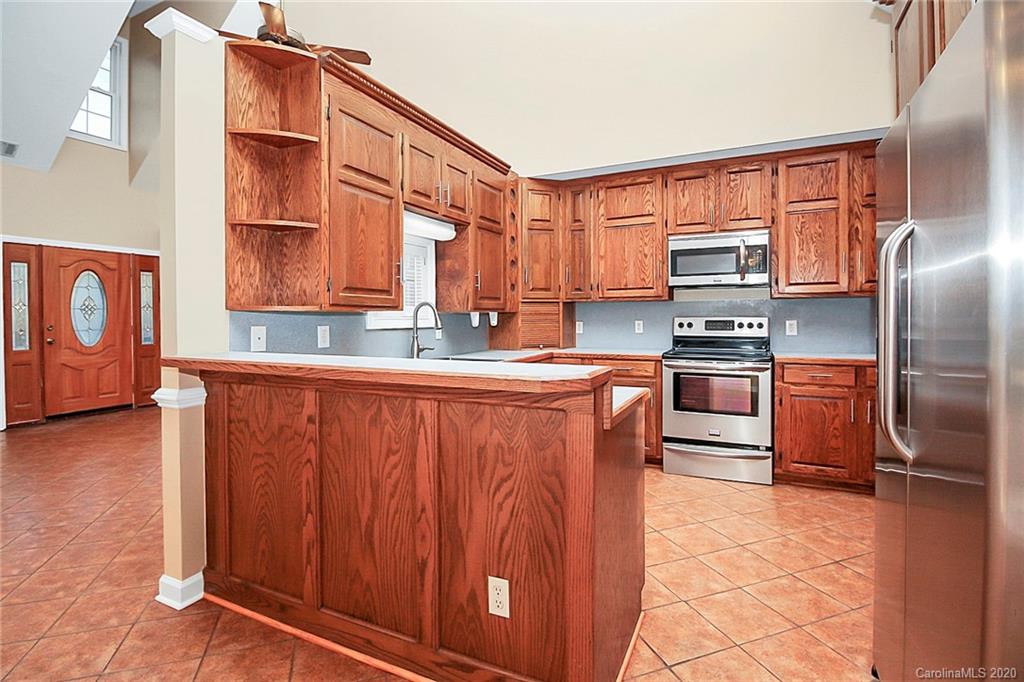 1465 Deer Run Road, Unit 3 Catawba, SC 29704 - Photo 4 of 31 a kitchen with stainless steel appliances granite countertop a refrigerator and a stove top oven