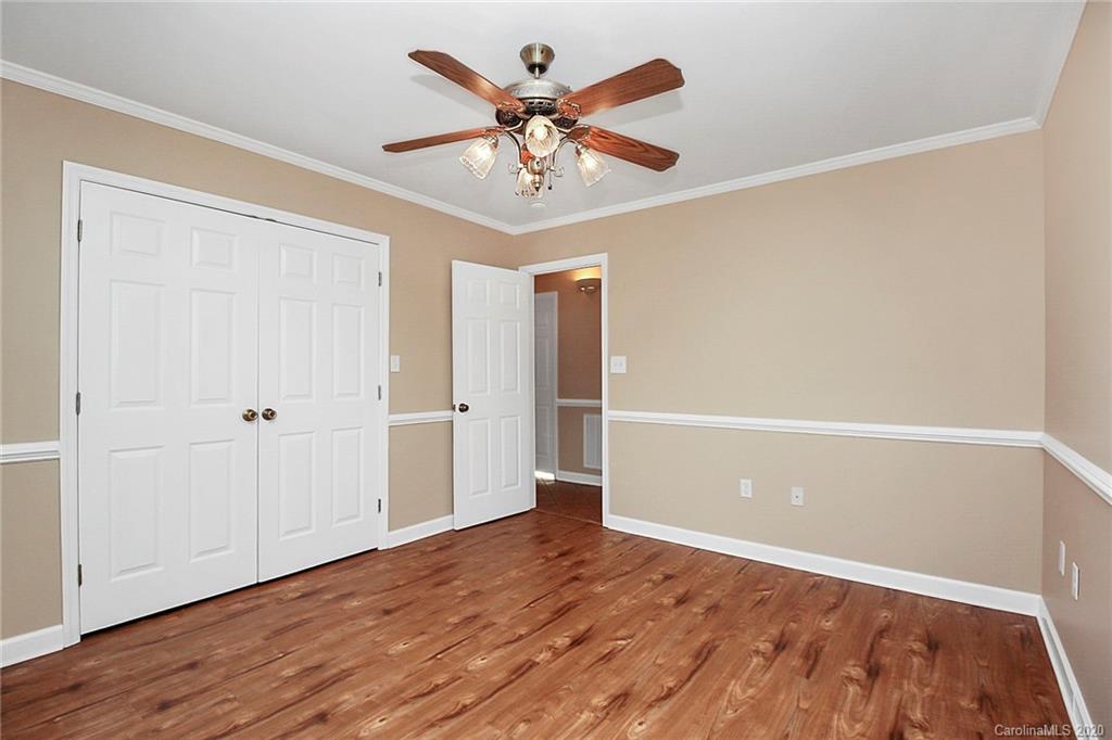 1465 Deer Run Road, Unit 3 Catawba, SC 29704 - Photo 9 of 31 wooden floor in an empty room with a window