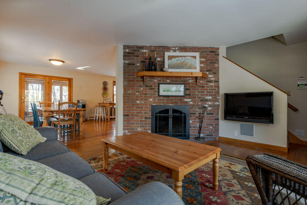 95 Cannon Hill Road Wellfleet, MA 02667 - Photo 12 of 36 a living room with furniture and a flat screen tv
