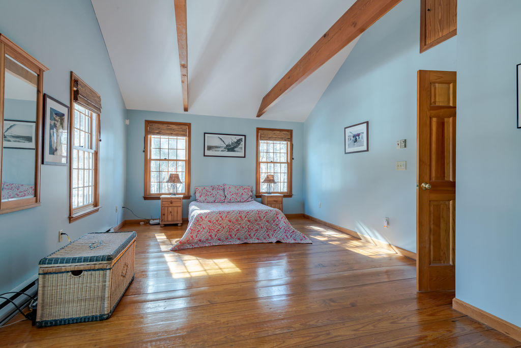 95 Cannon Hill Road Wellfleet, MA 02667 - Photo 14 of 36 a spacious bedroom with a bed and window