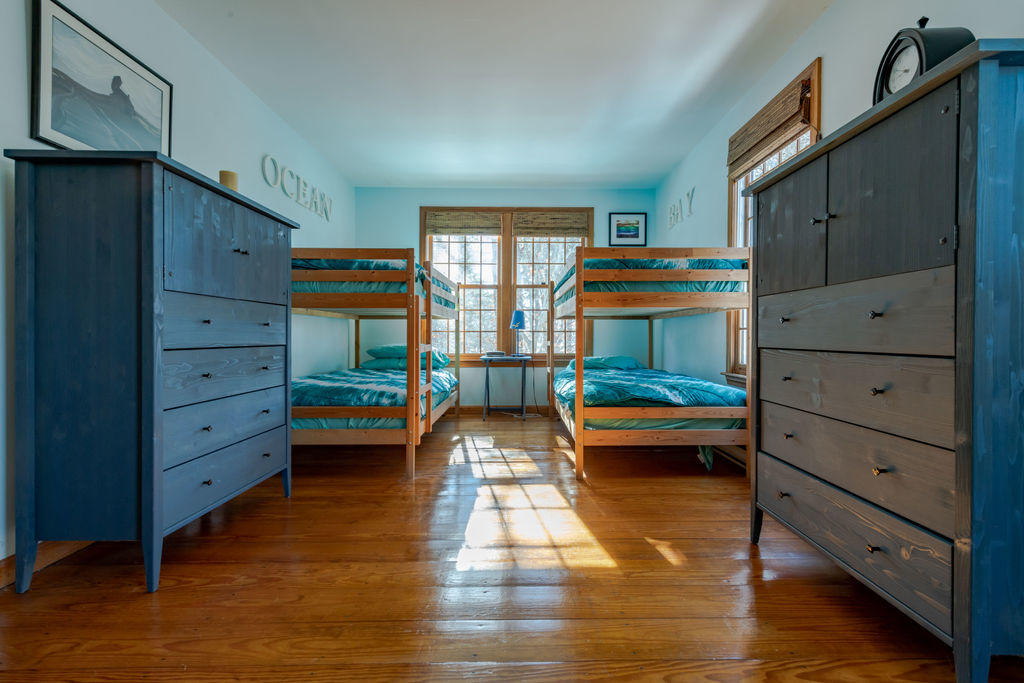 95 Cannon Hill Road Wellfleet, MA 02667 - Photo 17 of 36 a bedroom with a bed and wooden floor