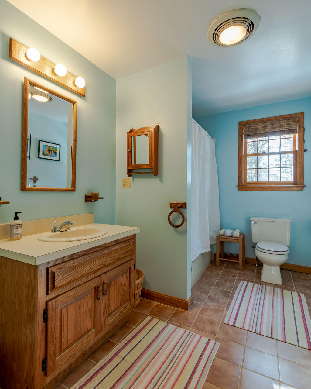 95 Cannon Hill Road Wellfleet, MA 02667 - Photo 18 of 36 a room with a sink and a mirror