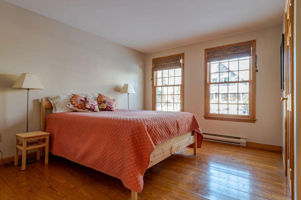 95 Cannon Hill Road Wellfleet, MA 02667 - Photo 20 of 36 a bedroom with a bed and wooden floor
