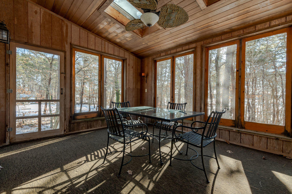 95 Cannon Hill Road Wellfleet, MA 02667 - Photo 22 of 36 a view of a dining room with furniture and windows