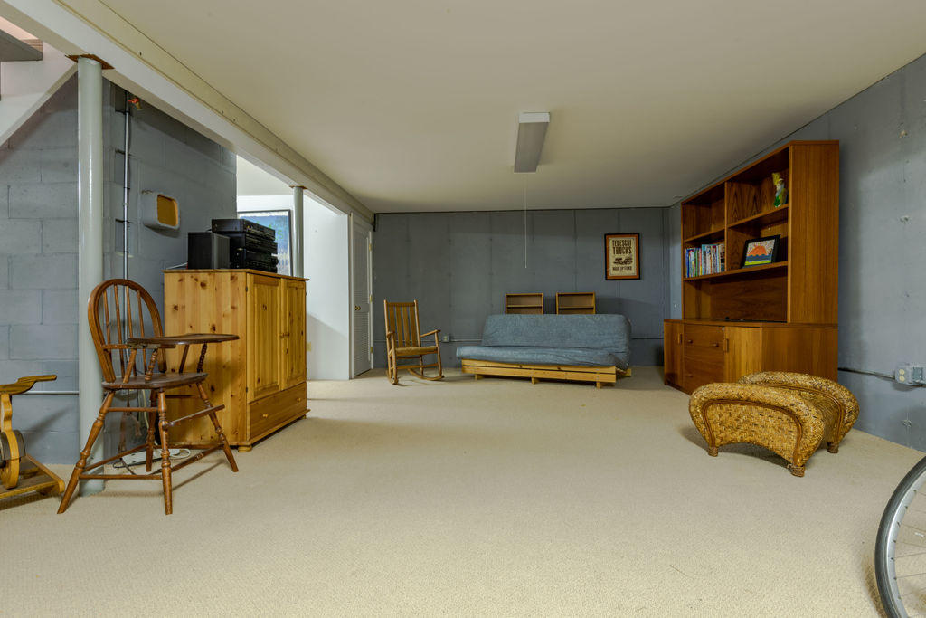95 Cannon Hill Road Wellfleet, MA 02667 - Photo 23 of 36 a bedroom with furniture and a gym machine