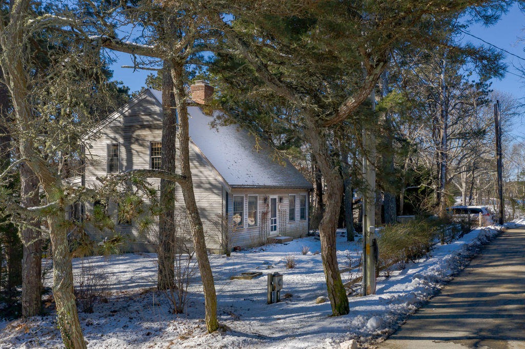 95 Cannon Hill Road Wellfleet, MA 02667 - Photo 30 of 36 a view of a house with a tree