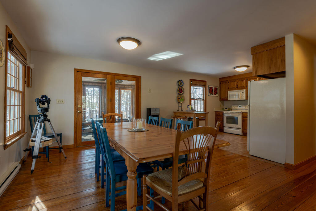 95 Cannon Hill Road Wellfleet, MA 02667 - Photo 8 of 36 a view of a a dining room with furniture window and wooden floor