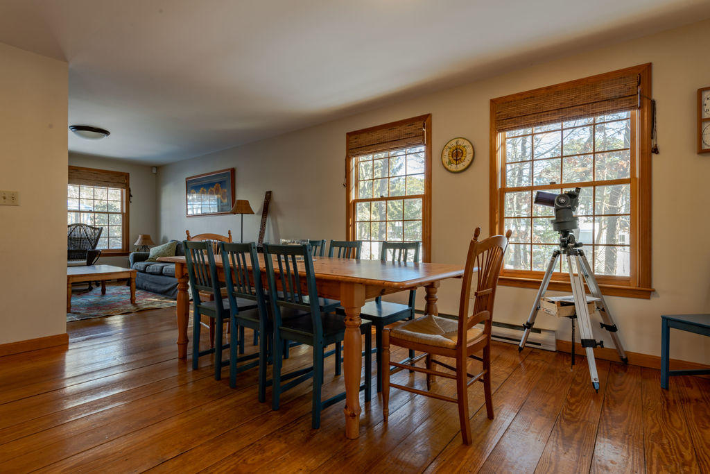 95 Cannon Hill Road Wellfleet, MA 02667 - Photo 10 of 36 a view of a dining room with furniture and wooden floor