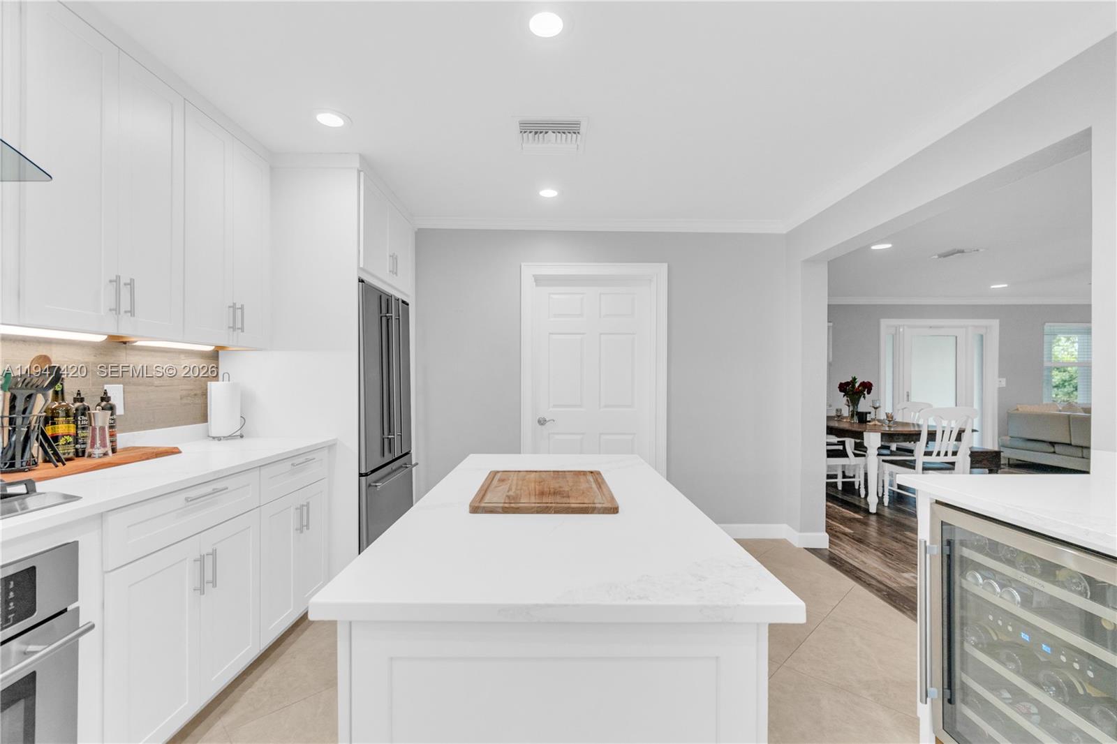 1405 Southwest 4th Terrace Pompano Beach, FL 33060 - Photo 18 of 44 a kitchen with a sink stove and cabinets