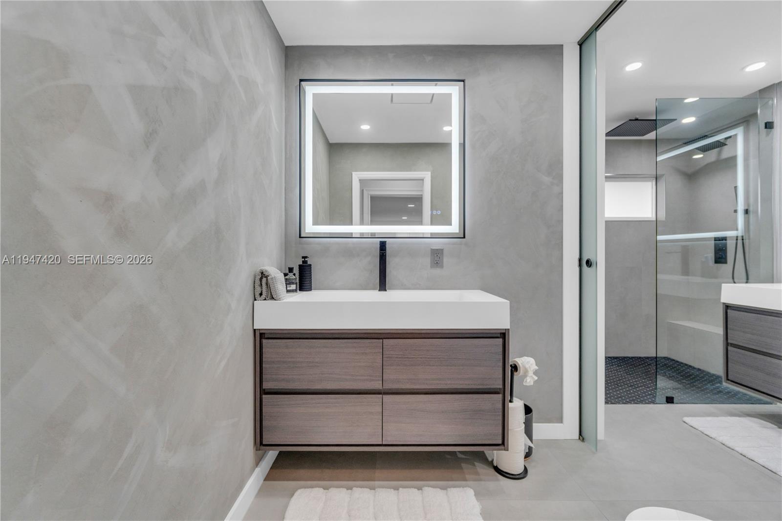 1405 Southwest 4th Terrace Pompano Beach, FL 33060 - Photo 28 of 44 a bathroom with a sink and a mirror