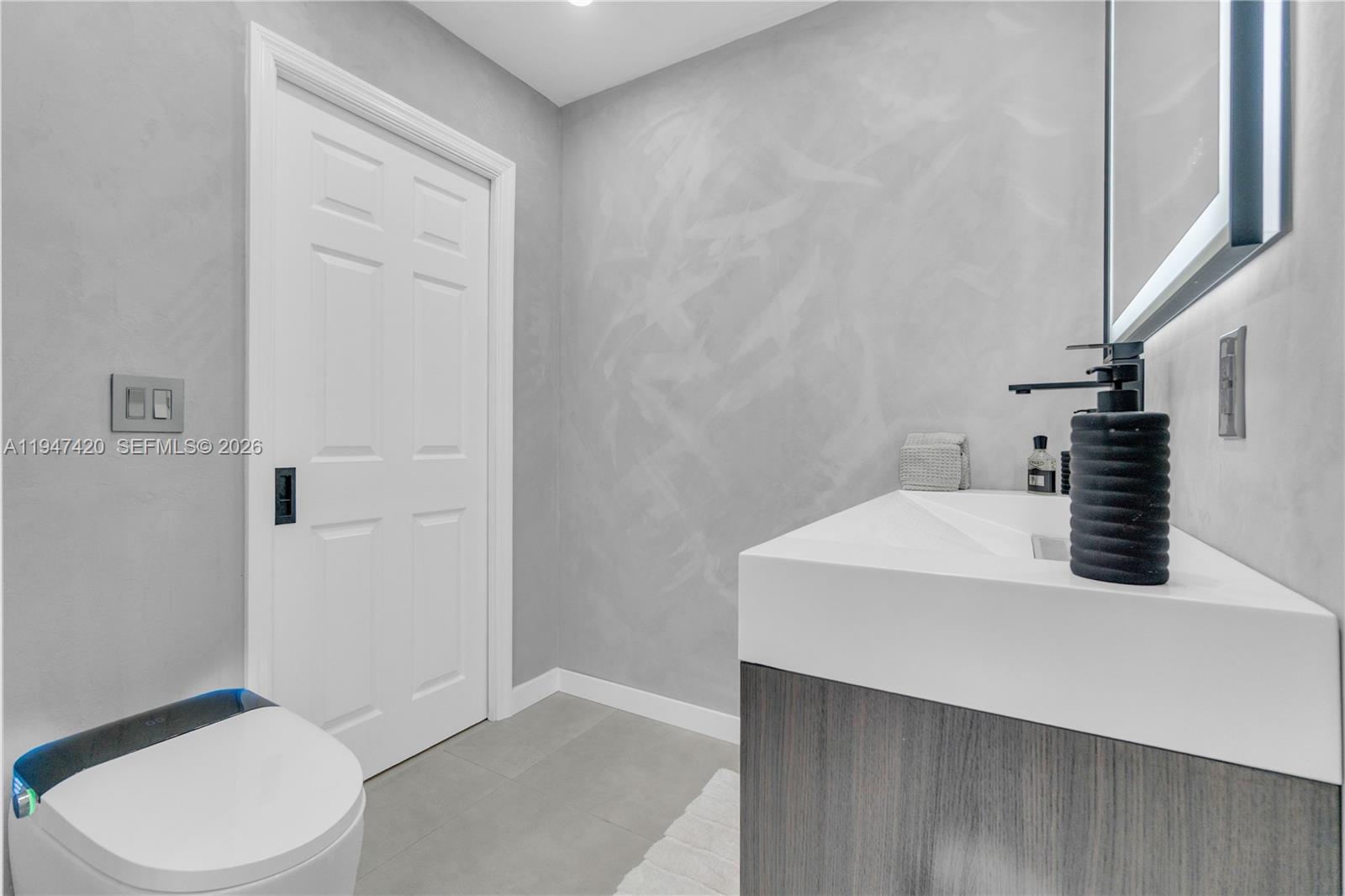 1405 Southwest 4th Terrace Pompano Beach, FL 33060 - Photo 30 of 44 a bathroom with a sink a toilet and shower