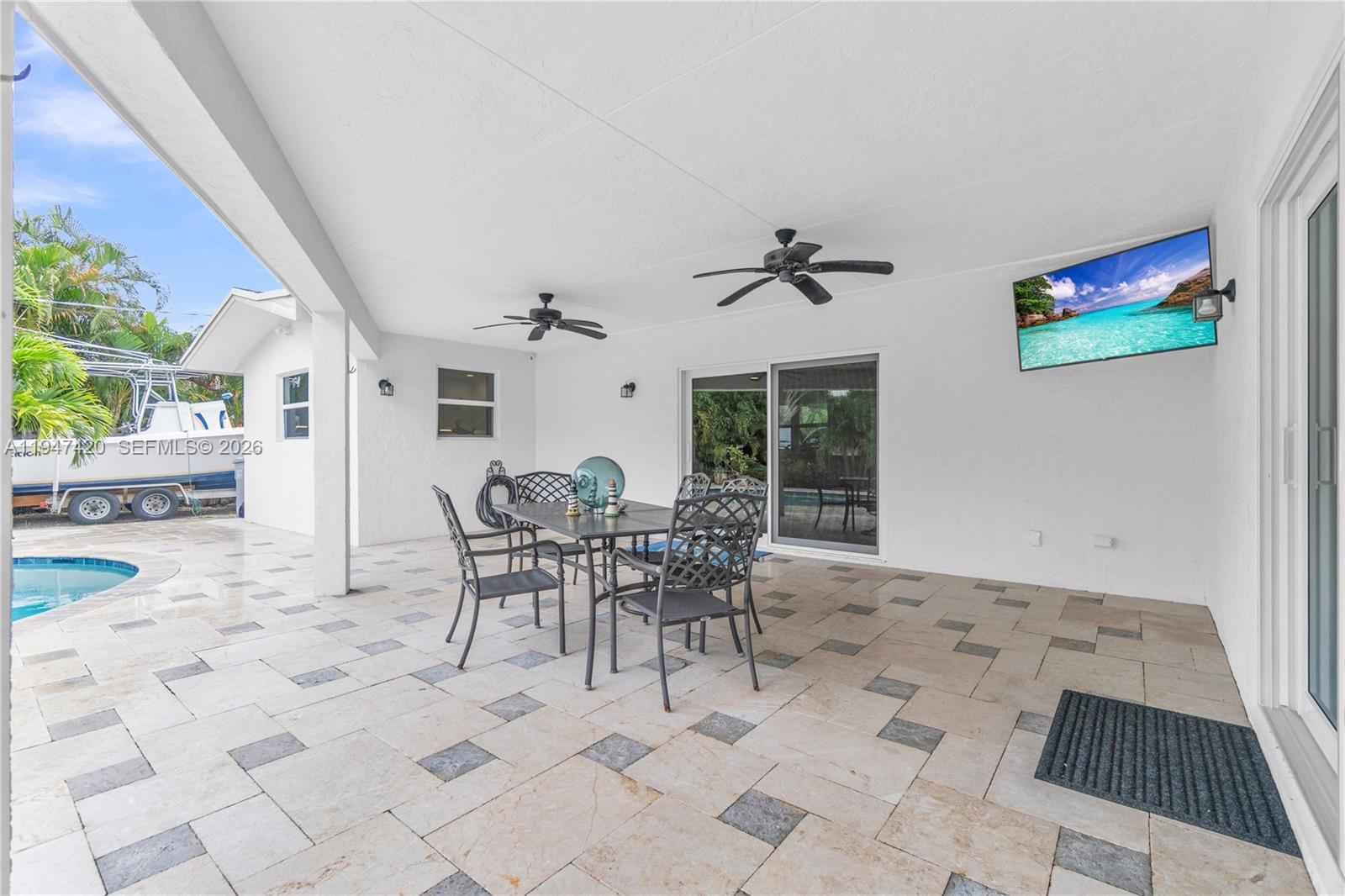 1405 Southwest 4th Terrace Pompano Beach, FL 33060 - Photo 36 of 44 a view of a dining room that has a rug and a table