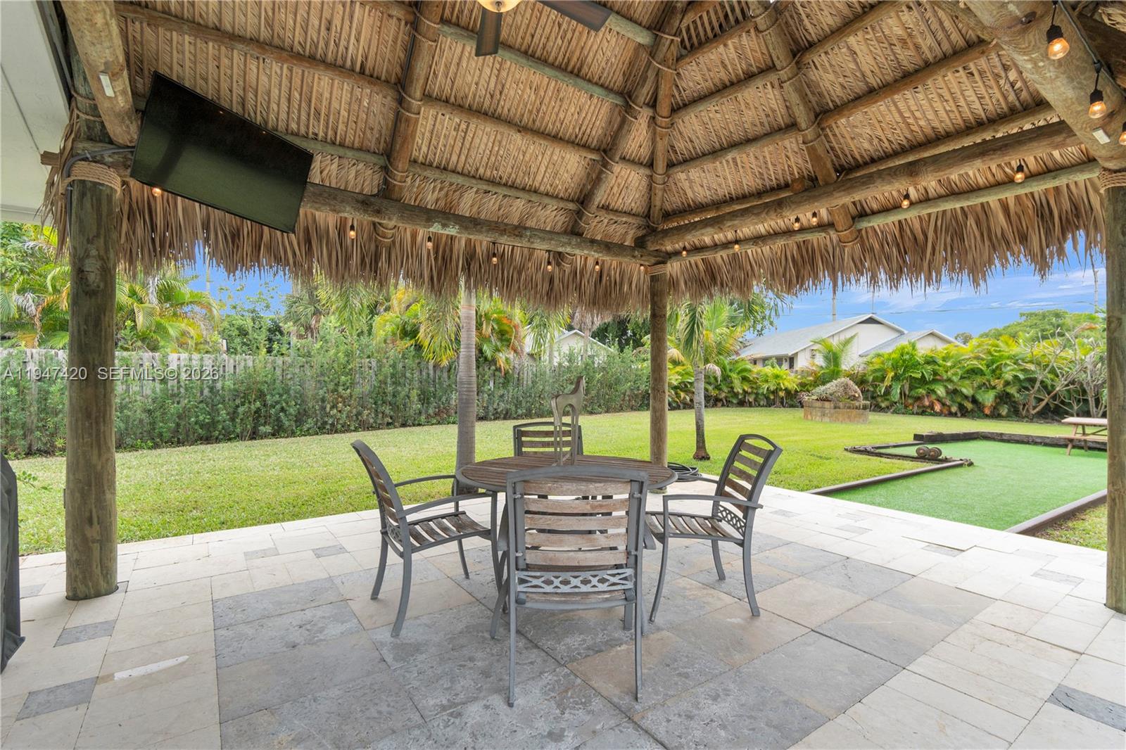 1405 Southwest 4th Terrace Pompano Beach, FL 33060 - Photo 40 of 44 a patio with a yard table and chairs