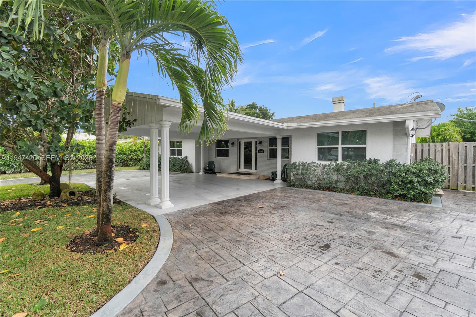 1405 Southwest 4th Terrace Pompano Beach, FL 33060 - Photo 4 of 44 a front view of a house with garden