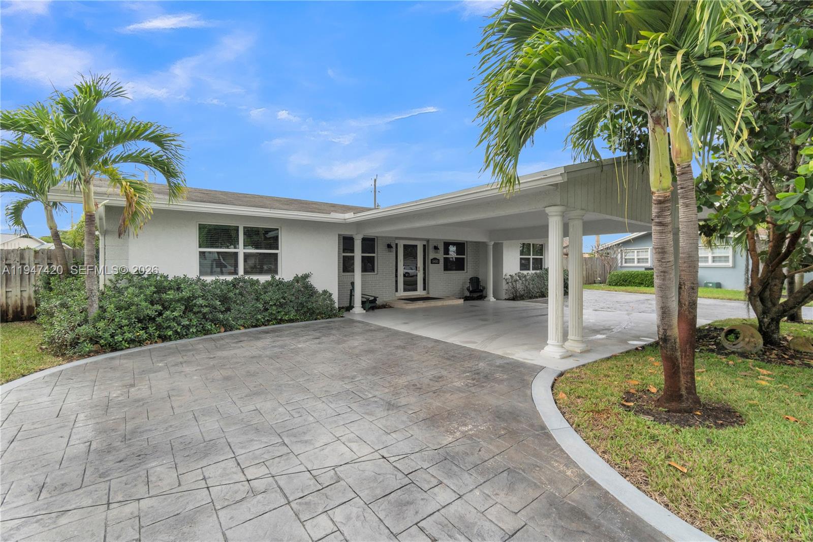 1405 Southwest 4th Terrace Pompano Beach, FL 33060 - Photo 44 of 44 a view of a house with a porch