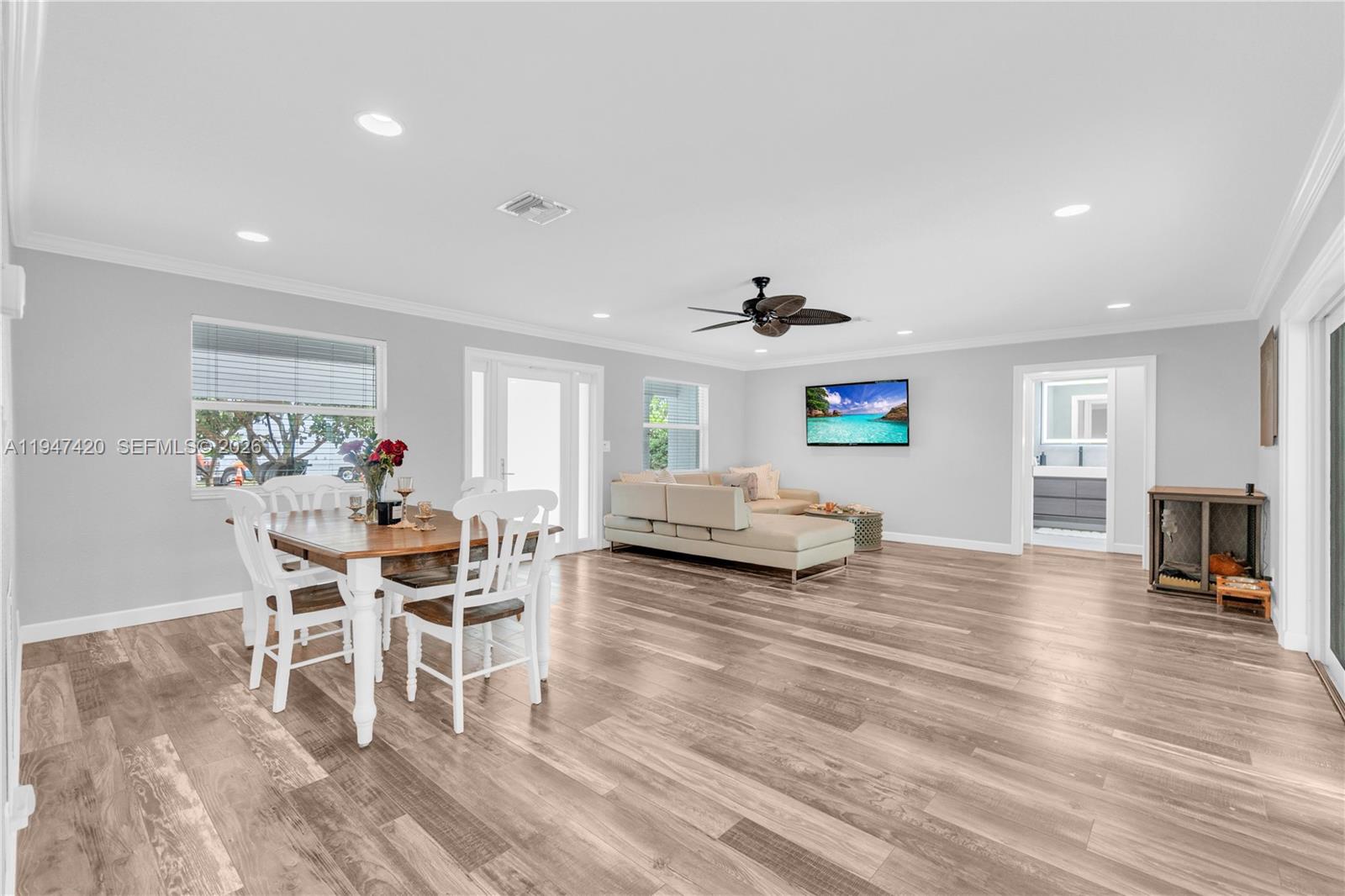 1405 Southwest 4th Terrace Pompano Beach, FL 33060 - Photo 7 of 44 a living room with furniture and a wooden floor