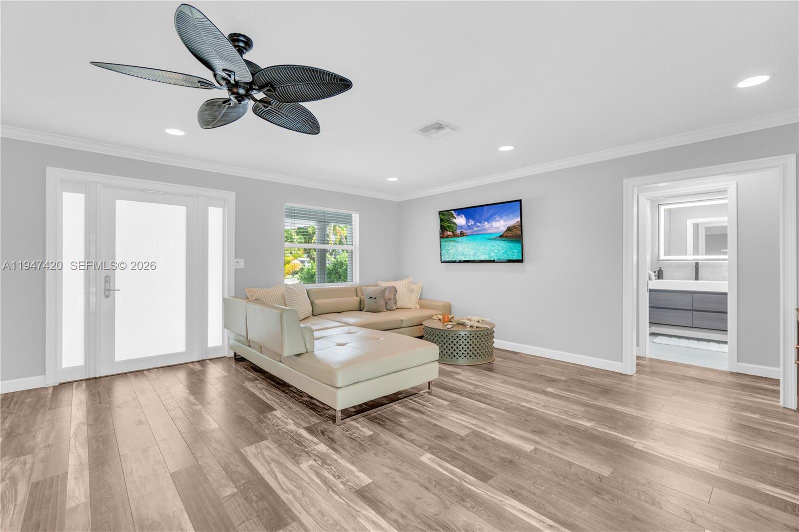 1405 Southwest 4th Terrace Pompano Beach, FL 33060 - Photo 10 of 44 a living room with furniture and a wooden floor