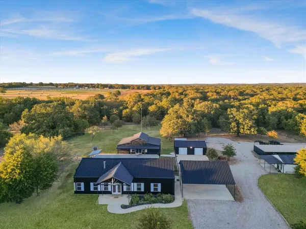 a aerial view of a house with big yard