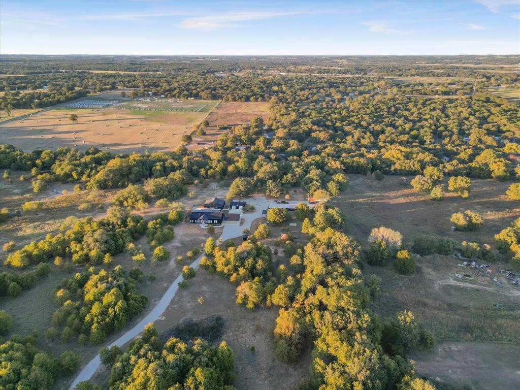 7601 Zion Hill Road Poolville, TX 76487 - Photo 9 of 39 an aerial view of residential building and lake view