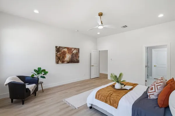 a bedroom with bed and a couch