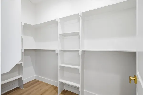 a view of an empty walk in closet