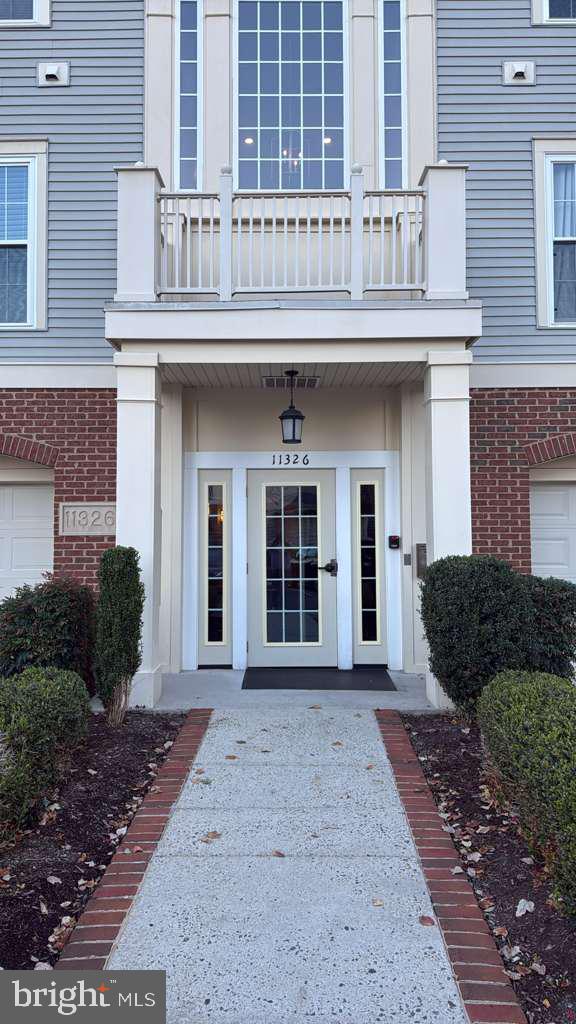 11326 Westbrook Mill Lane, Unit 202 Fairfax, VA 22030 - Photo 1 of 15 a front view of a house