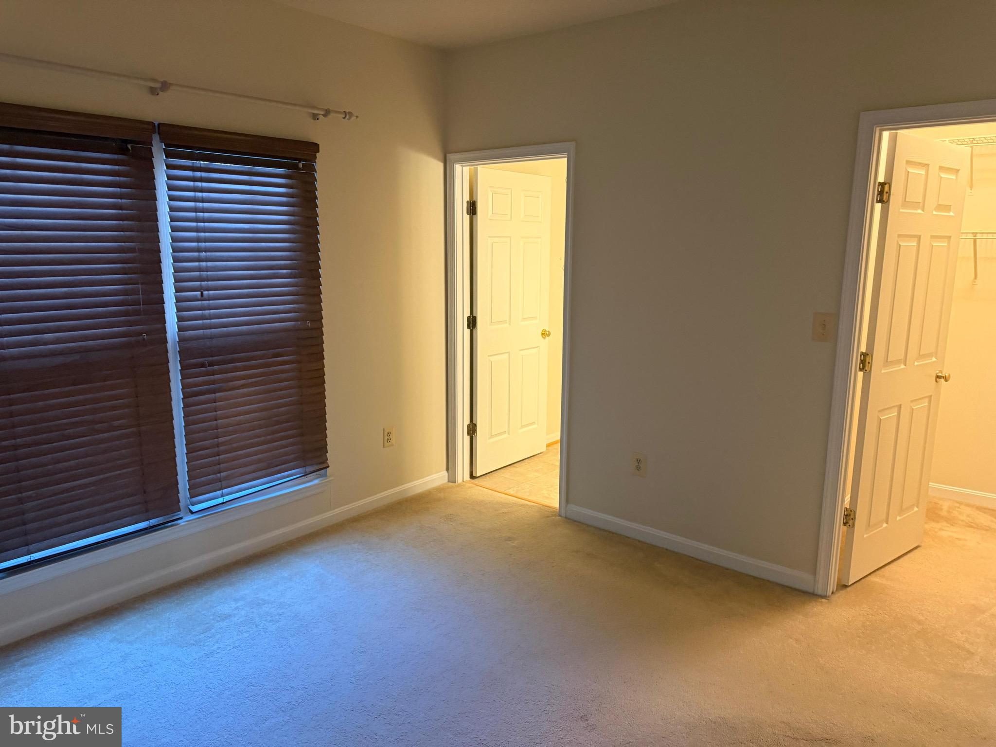 11326 Westbrook Mill Lane, Unit 202 Fairfax, VA 22030 - Photo 13 of 15 a view of an empty room with a window