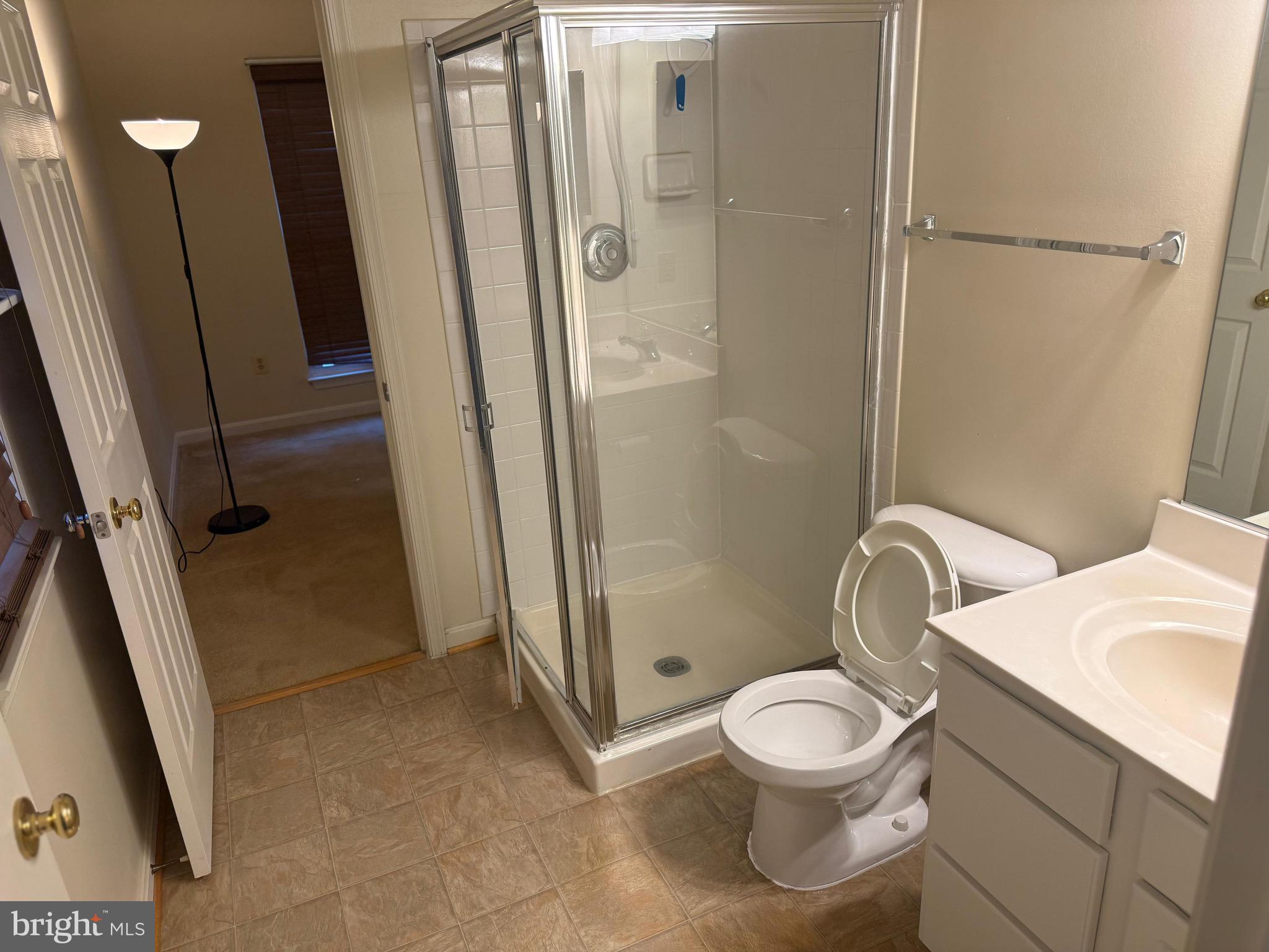 11326 Westbrook Mill Lane, Unit 202 Fairfax, VA 22030 - Photo 15 of 15 a bathroom with a toilet and a shower