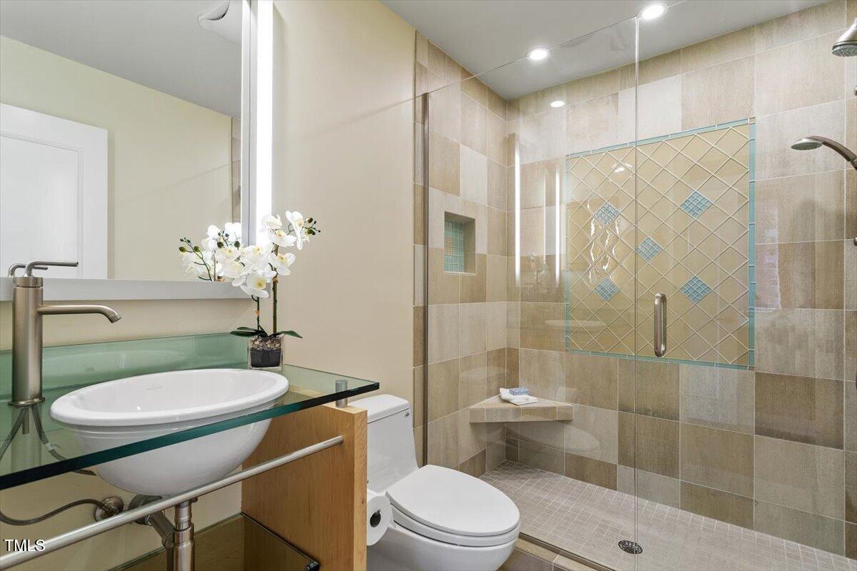 10729 Trego Trail Raleigh, NC 27614 - Photo 30 of 65 Bedroom Two's Remodeled Full Bath with Walk-in Shower and Modern Vessel Sink