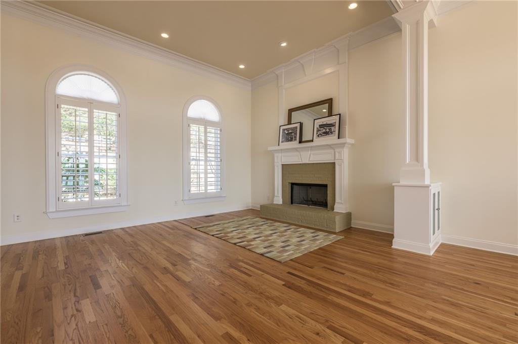 9510 Lisa Circle Gainesville, GA 30506 - Photo 20 of 80 a view of empty room with wooden floor and fireplace